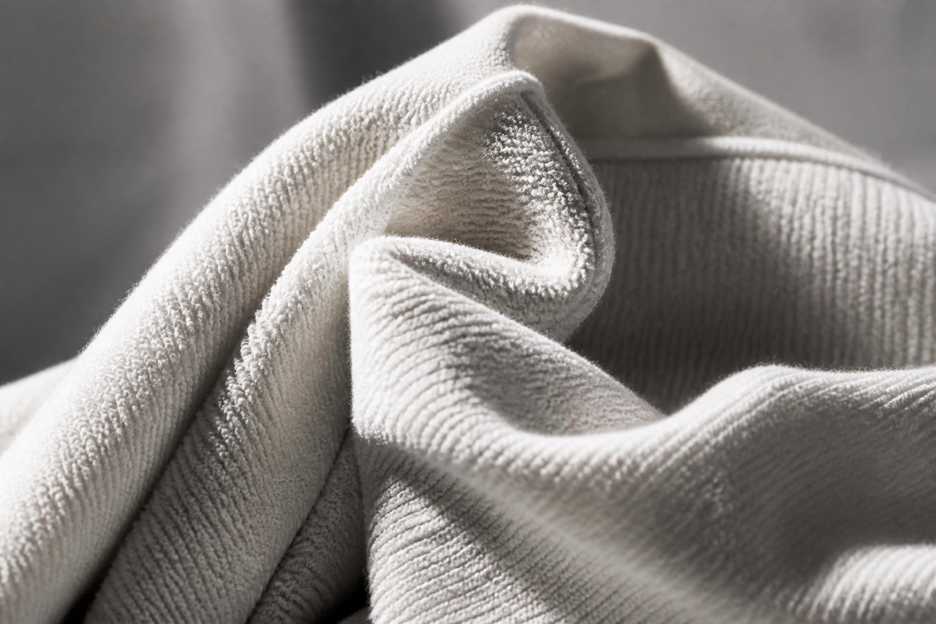 Macro detail of heavyweight off-white cotton fleece fabric